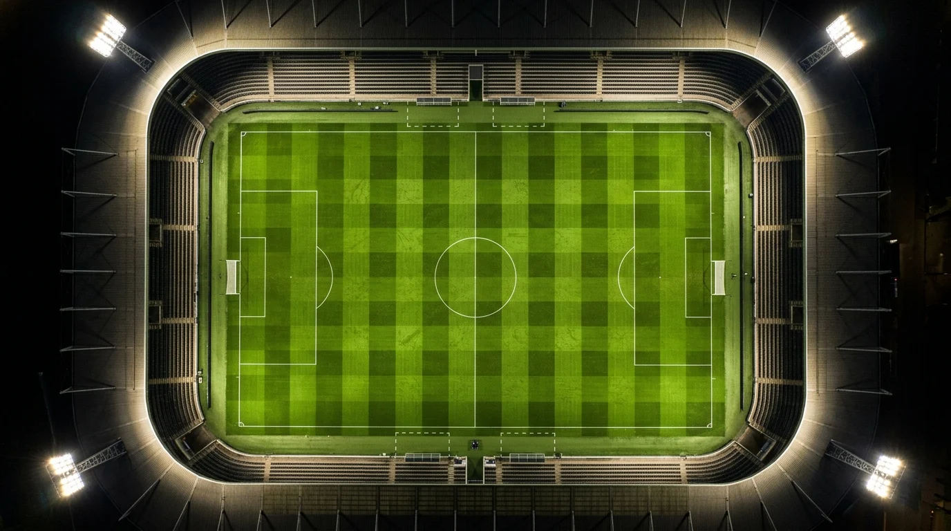 Overhead view of an illuminated football pitch.