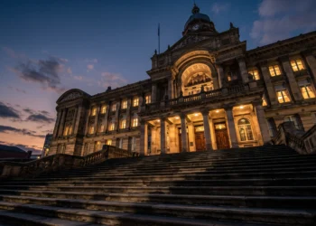 Conceptual image of a municipal city hall building under dramatic lighting.