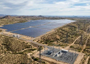 Aerial conceptual view of a solar farm integrated with a modern power grid.