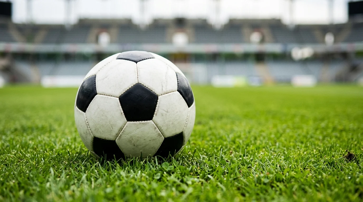 A soccer ball on a green grass field.